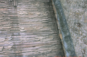Specialists in re-roofing churches, church porch roof stripped back to the old lath plaster