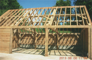 Oak framed garage roof with concrete tiles