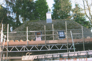 Velux roof lights installed into an old Cotswold stone tiled roof